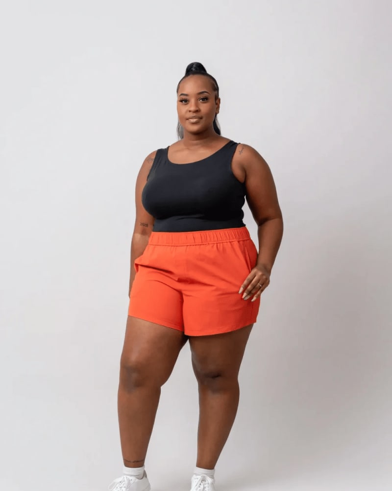 Front of a model wearing a size 3X surf's up shorts (5") in Hot Sauce by alder apparel. | dia_product_style_image_id:300701